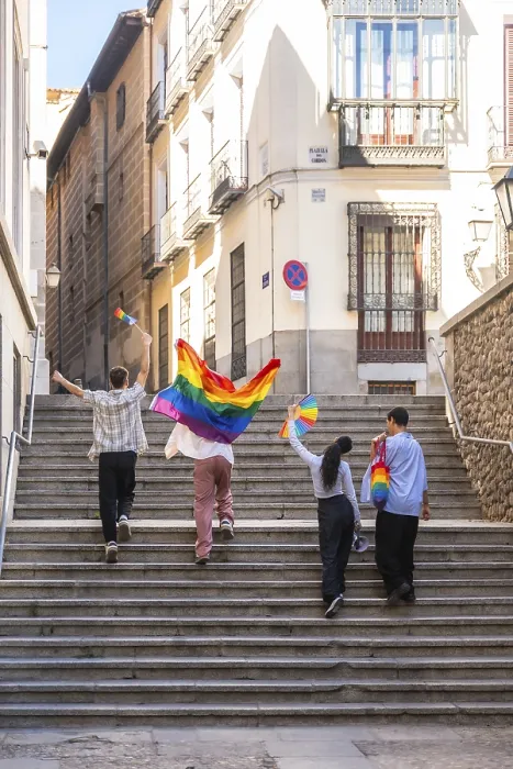 Framed Print : Young adults are joyfully walking up stone stairs in a european city