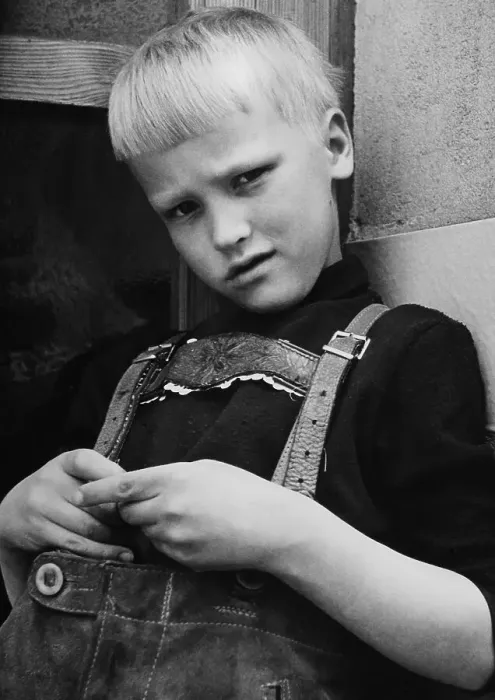 Framed Print : Young boy wearing lederhosen, traditional leather trousers