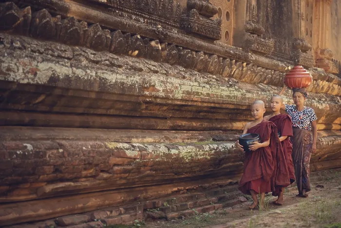 Framed Print : Young Buddhist novice monks walking morning alms in Old Bagan
