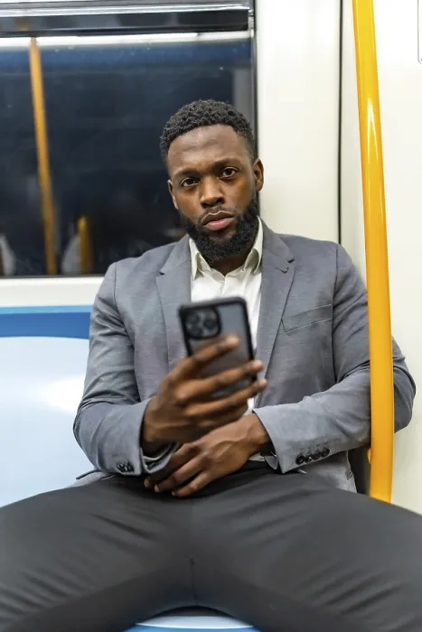 Framed Print : Young businessman commuting on a subway train