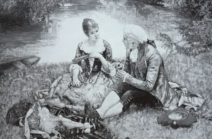 Framed Print : Young couple sitting at a picnic by a river