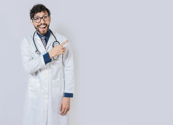 Framed Print : Young doctor pointing a promotion with finger Framed Print : Young doctor pointing a promotion with finger