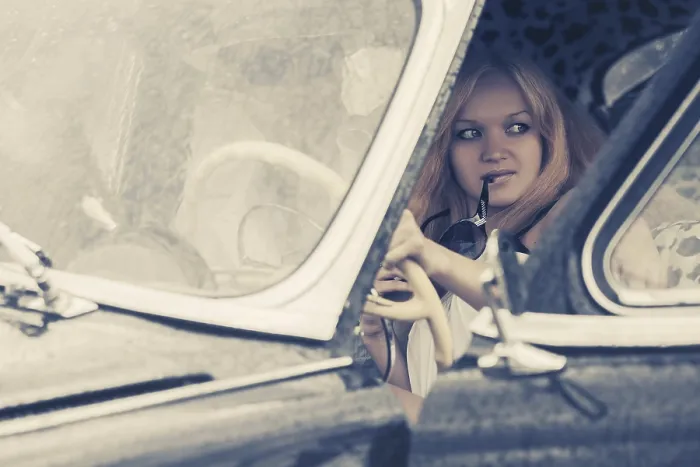 Framed Print : Young fashion couple driving vintage car