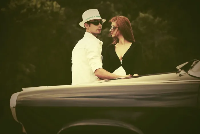 Framed Print : Young fashion couple in love next to vintage car Framed Print : Young fashion couple in love next to vintage car