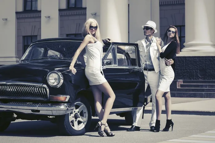 Framed Print : Young fashion people next to vintage car Framed Print : Young fashion people next to vintage car
