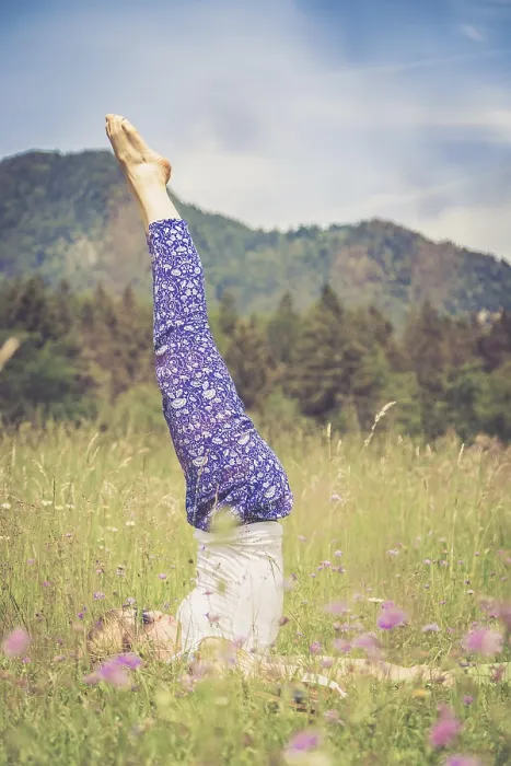 Framed Print : Young girl is doing yoga in the park