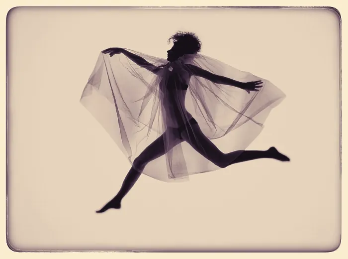 Framed Print : Young jumping woman with wing veil Framed Print : Young jumping woman with wing veil