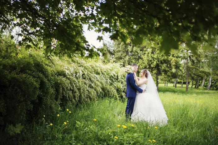Framed Print : Young lovely and cheerfull wedding couple walking at the park