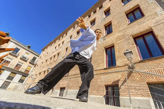 Framed Print : Young man actively performing a passionate flamenco move on a city street