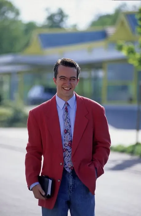 Framed Print : Young man with diary and red jacket
