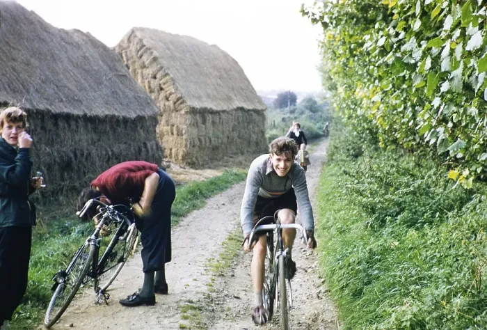 Framed Print : Young men in a cycling club ride their bicycles past haystacks on a country lane, Kent, England, UK 1956