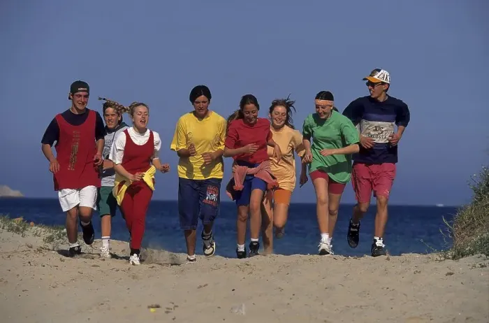 Framed Print : Young people at the beach run Group of 8