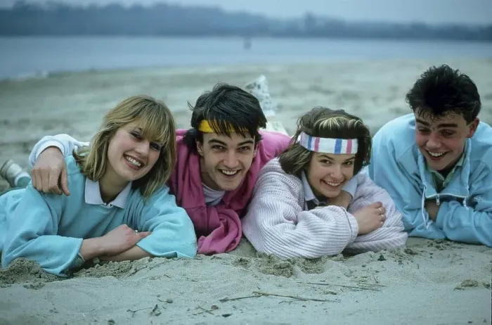 Framed Print : Young people lying on the beach 2 couples
