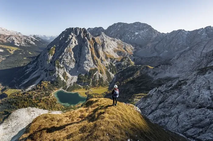 Framed Print : Young woman with climbing helmet looking at Seebensee from the Ehrwalder Sonnenspitze