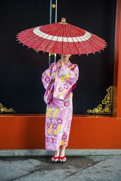 Framed Print : Young woman in kimono and with oil-paper umbrella
