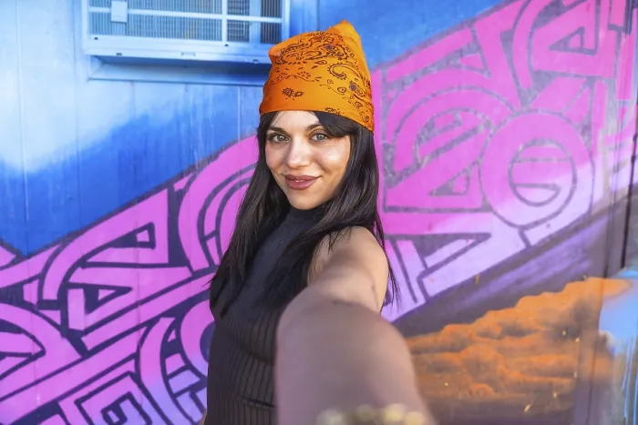 Framed Print : Young woman with orange bandana smiling