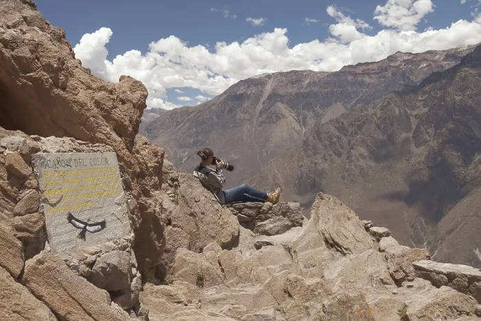 Framed Print : Young woman photographing condors in Colca Framed Print : Young woman photographing condors in Colca