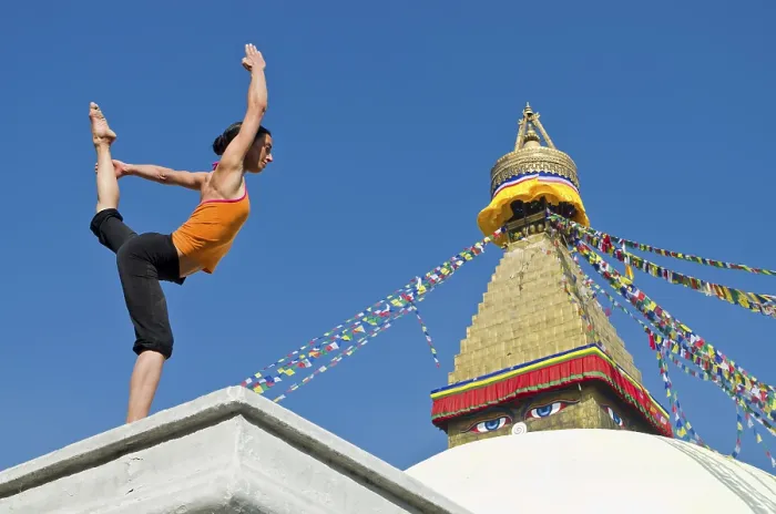 Framed Print : Young woman practicing yoga at Boudnanath stupa