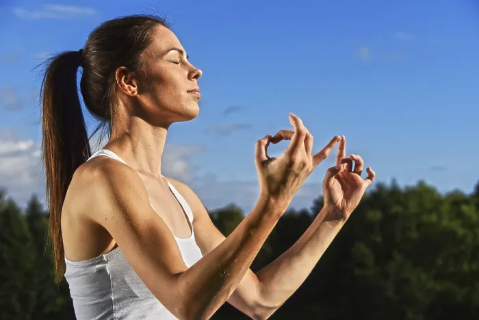 Framed Print : Young woman during yoga meditation in the park