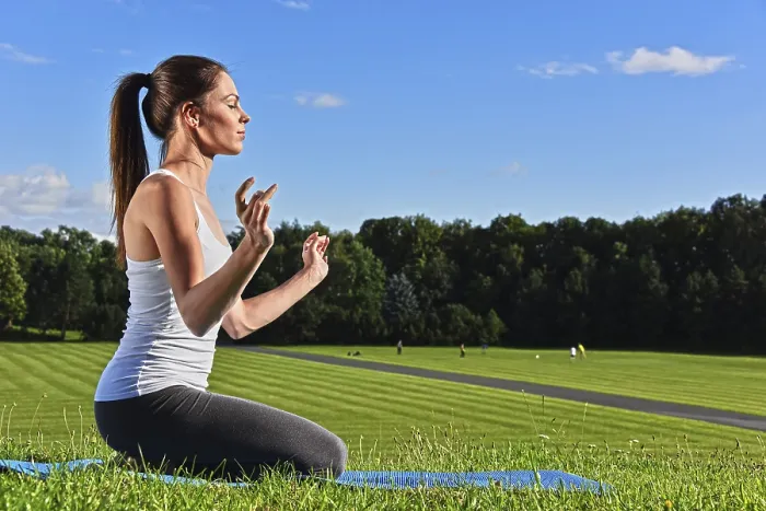 Framed Print : Young woman during yoga meditation in the park