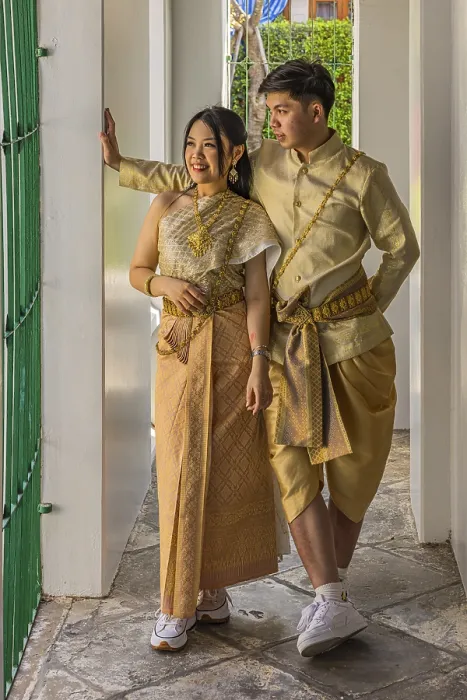 Framed Print : Young woman and young man in traditional clothing present themselves for the photographers