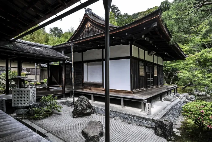 Framed Print : Zen garden with traditional pavilion surrounded by carefully arranged rocks and green vegetation Framed Print : Zen garden with traditional pavilion surrounded by carefully arranged rocks and green vegetation