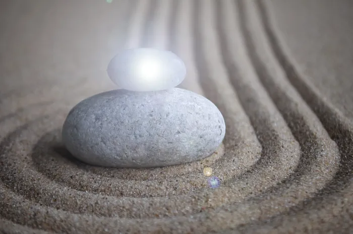 Framed Print : Zen stones with shining light on sand with customizable space for text or message Framed Print : Zen stones with shining light on sand with customizable space for text or message