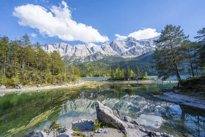 Framed Print : Zugspitze massif and Zugspitze reflected in Eibsee lake