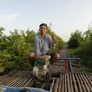Cambodian Man on Bamboo Train, Battambang Print