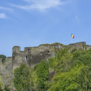 9th century medieval ruined hill castle overlooking the city La Roche-en-Ardenne in summer 9th century medieval ruined hill castle overlooking the city La Roche-en-Ardenne in summer
