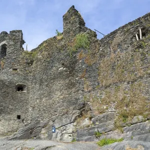9th century medieval ruined hill castle overlooking the city La Roche-en-Ardenne in summer 9th century medieval ruined hill castle overlooking the city La Roche-en-Ardenne in summer