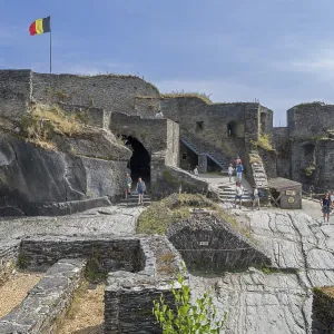 9th century medieval ruined hill castle overlooking the city La Roche-en-Ardenne in summer 9th century medieval ruined hill castle overlooking the city La Roche-en-Ardenne in summer