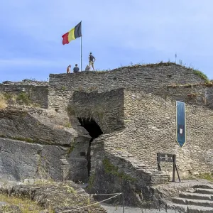 9th century medieval ruined hill castle overlooking the city La Roche-en-Ardenne in summer 9th century medieval ruined hill castle overlooking the city La Roche-en-Ardenne in summer