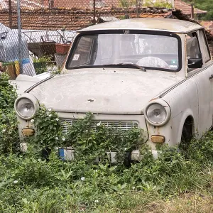 Abandoned old neglected Trabant car in eastern Europe village Abandoned old neglected Trabant car in eastern Europe village