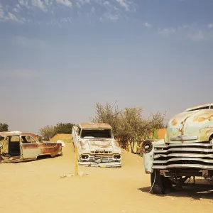Abandoned vintage cars at the hamlet of Solitaire between Sawakopmund and Sesriem at the edge of the Namib Desert Abandoned vintage cars at the hamlet of Solitaire between Sawakopmund and Sesriem at the edge of the Namib Desert