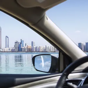 Abu Dhabi Skyline with water and blue sky Abu Dhabi Skyline with water and blue sky