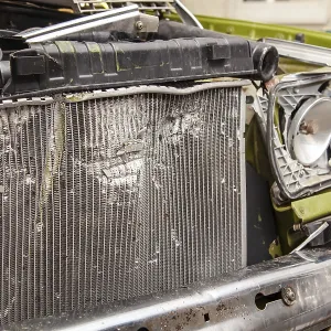 Accident, Car crash collision. Closeup shot of a crashed oldtimer cars front with Vehicle Radiator Accident, Car crash collision. Closeup shot of a crashed oldtimer cars front with Vehicle Radiator