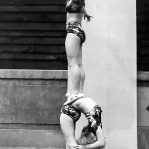 Two acrobats training, 1930s, Germany, Europe Two acrobats training, 1930s, Germany, Europe