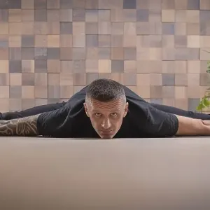 Adult man performs asana exercises. Yoga concept. Sports and healthy lifestyle Adult man performs asana exercises. Yoga concept. Sports and healthy lifestyle