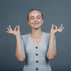 Adult young woman smile portrait in studio with yoga meditation ok mudra