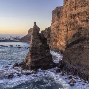 Aerial view of the cliffs and coast of Agaete at summer sunset in Gran Canaria Aerial view of the cliffs and coast of Agaete at summer sunset in Gran Canaria