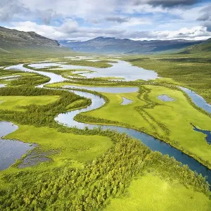 Aerial view, drone shot, meandering river landscape of the Rapa Valley near Nikkaluokta Aerial view, drone shot, meandering river landscape of the Rapa Valley near Nikkaluokta