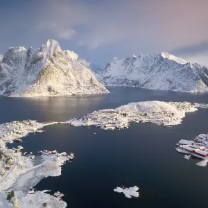 Aerial view, fishing village Reine in winter at dawn Aerial view, fishing village Reine in winter at dawn