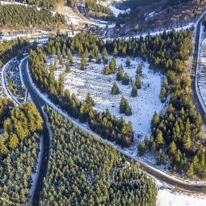 Aerial view, forest area in snow and Hochsauerlnad HohenstraBe L540 Aerial view, forest area in snow and Hochsauerlnad HohenstraBe L540