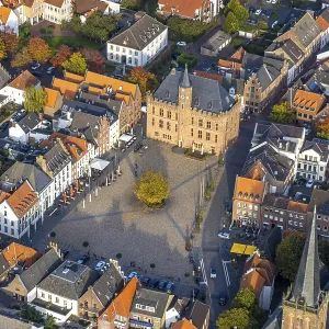 Aerial view, historic houses with gastronomy at the market place and tree in the centre
