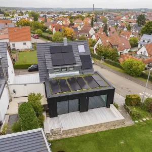 Aerial view of a house with solar system in a quiet residential area Aerial view of a house with solar system in a quiet residential area