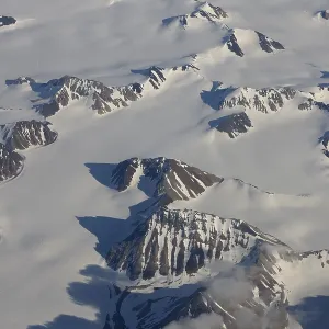 Aerial view of the inland ice with glaciated mountain landscape Aerial view of the inland ice with glaciated mountain landscape