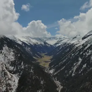 Aerial view of mountains and Krimml Waterfalls on sunny day Aerial view of mountains and Krimml Waterfalls on sunny day