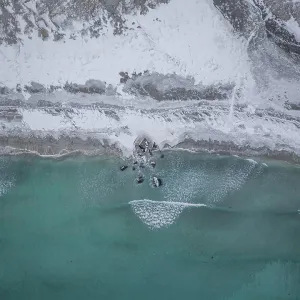 Aerial view, snowy beach, coast, Flakstad, Norway Aerial view, snowy beach, coast, Flakstad, Norway