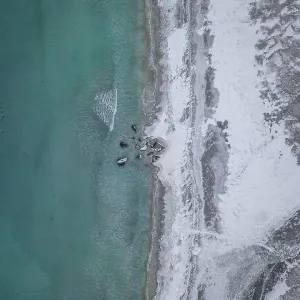 Aerial view, snowy beach, coast, Flakstad, Norway